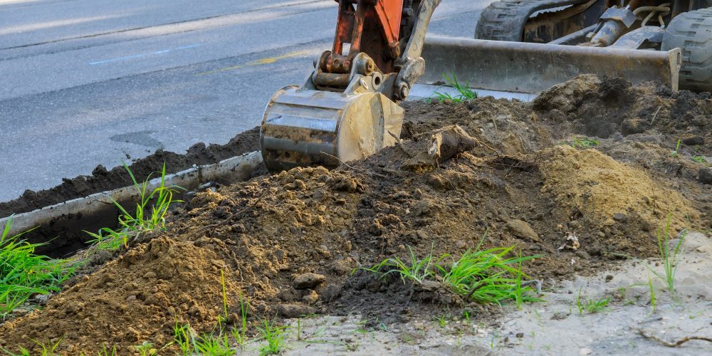 digger-working-at-construction-in-excavation-pit-LYWQ7S3